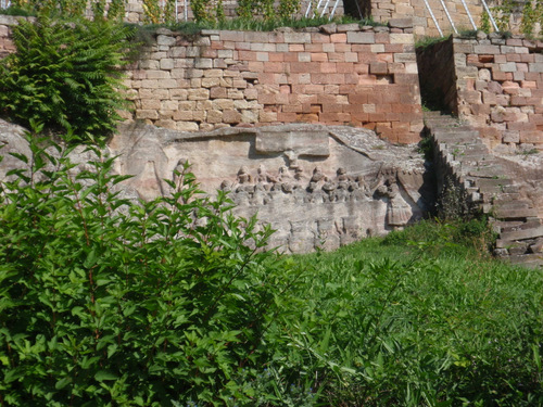 stone carvings that appear to be dinner, feast, or festival oriented.